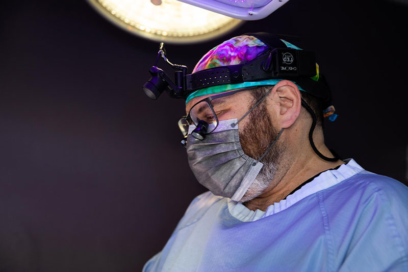 Dr. rosenthal performing oral surgery procedure
